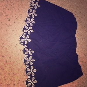 Blue navy shorts with white flowers at the bottom